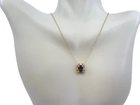 10K Yellow Gold 7x5mm Oval Cut Created Alexandrite and 0.03cttw Diamond Necklace - 18 Inches