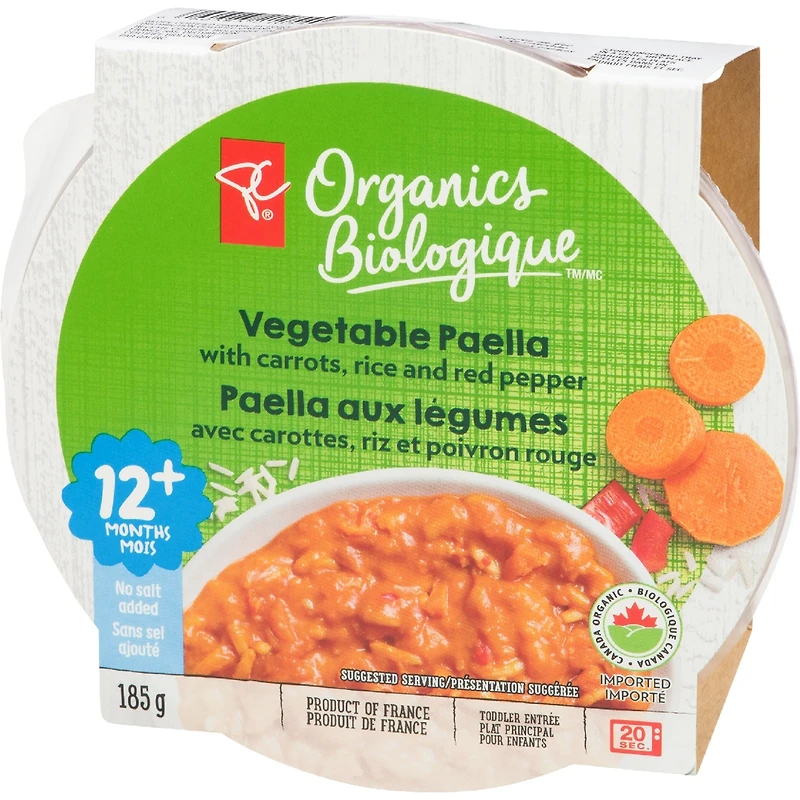 Plat Paella aux légumes avec carottes, riz et poivrons rouges