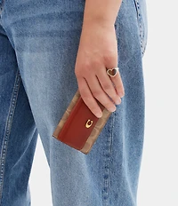 COACH Mini Signature Canvas Trifold Wallet