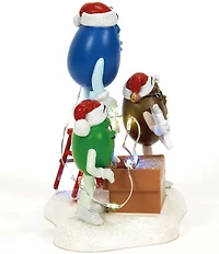 Department 56 North Pole Village Light Duty M&M's Figure
