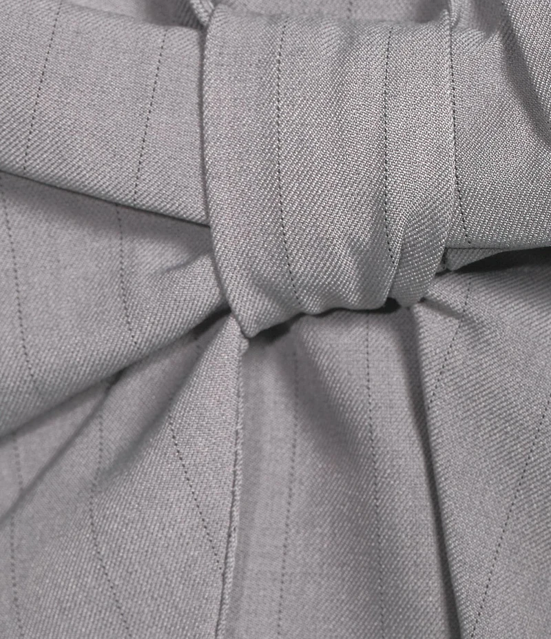 Evolutionary Strapless Woven Bow Front Top