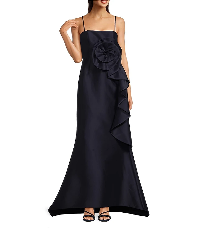 Marchesa Muse by Marchesa Stretch Mikado 3D Rosette Running Side Ruffle Straight Neck Spaghetti Strap Fit and Flare Gown | Pueblo Mall Marchesa Muse by Marchesa Stretch Mikado 3D Rosette Running Side Ruffle Straight Neck Spaghetti Strap Fit and Flare Gown | Pueblo Mall