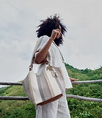 The Sak Roma Woven Straw Expandable Shoulder Bag