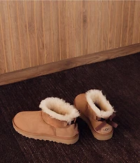UGG Women's Ultra Mini Bailey Bow Suede Shearling Lined Booties