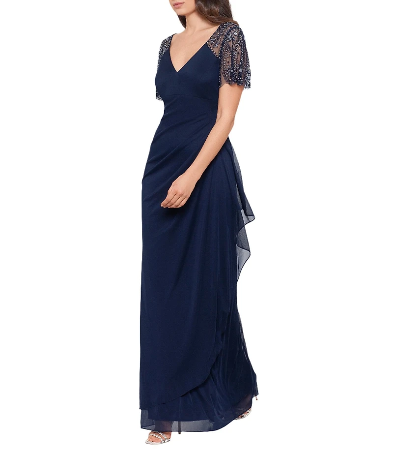 Xscape Short Beaded Sheer Flutter Sleeve Cascading Draped Waist V-Neck Beaded Gown