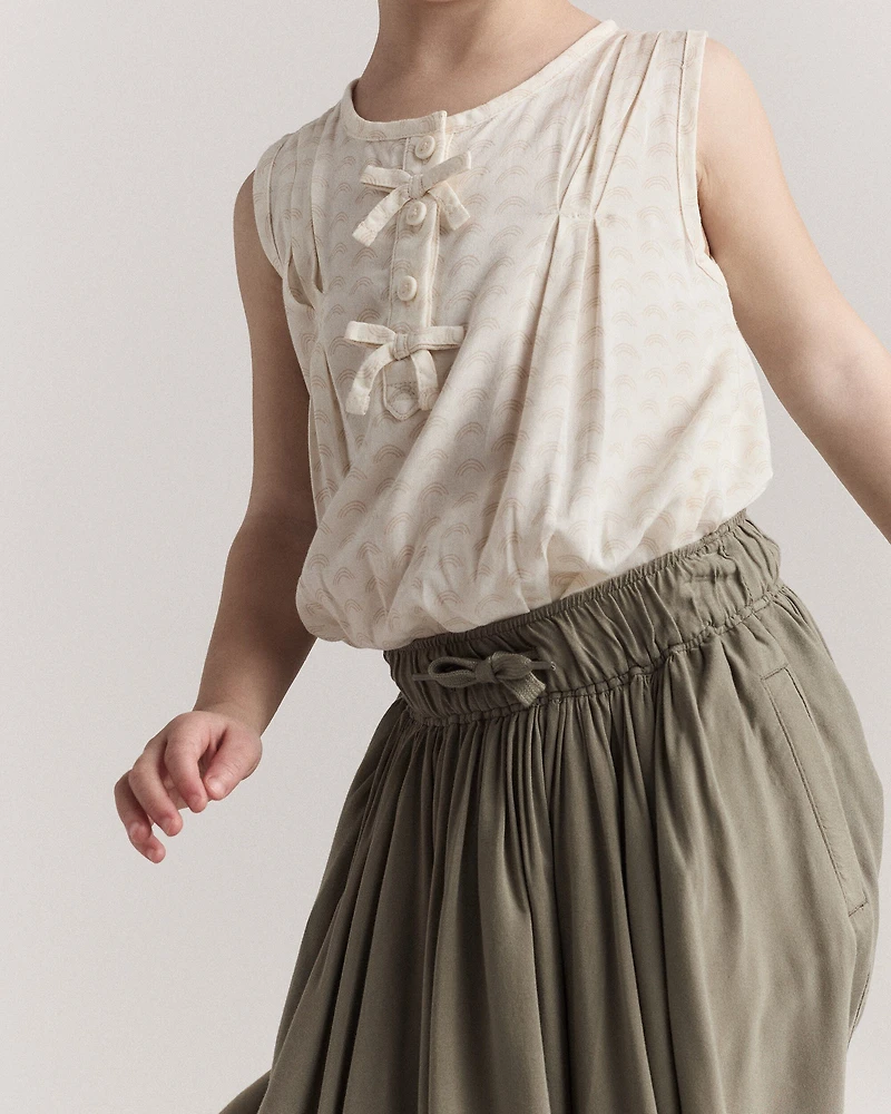 Toddler Girl Sleeveless Bow Top in Rainbow Print - Cream