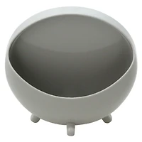 round navy vanity mirror with makeup brush storage