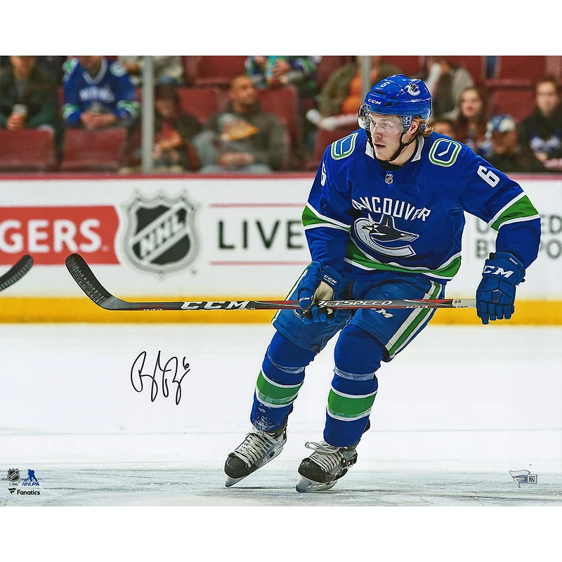 Brock Boeser Vancouver Canucks Autographed 16" x 20" Blue Jersey Skating Photograph