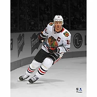 Jonathan Toews Chicago Blackhawks Unsigned White Jersey Skating Spotlight Photograph