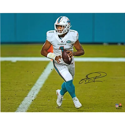 Tua Tagovailoa Miami Dolphins Autographed 16" x 20" White Jersey Rolling Out Photograph