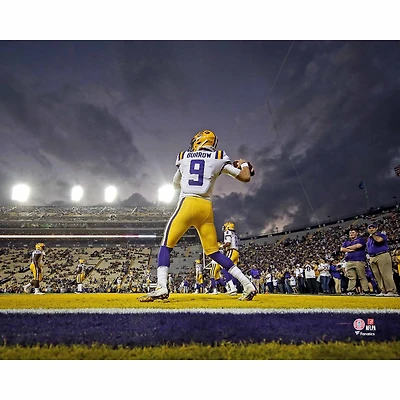 Joe Burrow LSU Tigers Unsigned White Jersey Warming Up At Night Under The Spotlights Photograph