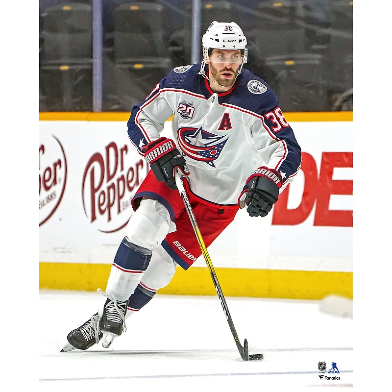Boone Jenner Columbus Blue Jackets Unsigned White Jersey Skating with Puck vs. Nashville Predators Photograph