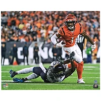 Ja'Marr Chase Cincinnati Bengals Autographed 16'' x 20'' Orange Breaking Tackle Photograph
