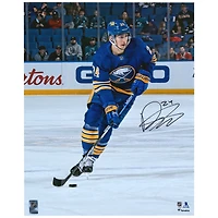Dylan Cozens Buffalo Sabres Autographed 16" x 20" Blue Jersey Skating with Puck Photograph