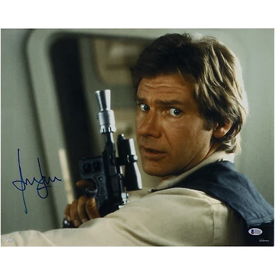 Harrison Ford The Empire Strikes Back Autographed 16" x 20" Holding a Gun Photograph - BAS