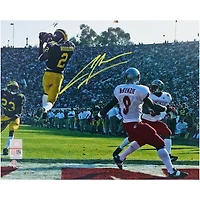Charles Woodson Michigan Wolverines Autographed 8" x 10" Leaping Interception Photograph - Signed in Yellow Ink