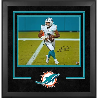 Tua Tagovailoa Miami Dolphins Autographed Deluxe Framed 16" x 20" White Jersey Rolling Out Photograph