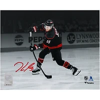 Jake Guentzel Carolina Hurricanes Autographed 8" x 10" Black Jersey Shooting Spotlight Photograph