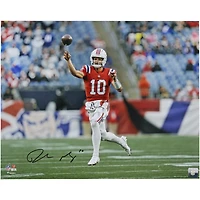 Drake Maye New England Patriots Autographed 16" x 20" Red Jersey Throwing Photograph
