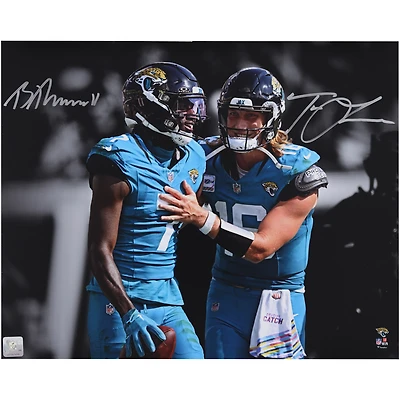 Trevor Lawrence & Brian Thomas Jr. Jacksonville Jaguars Autographed 16" x 20" Teal Jersey Spotlight Photograph