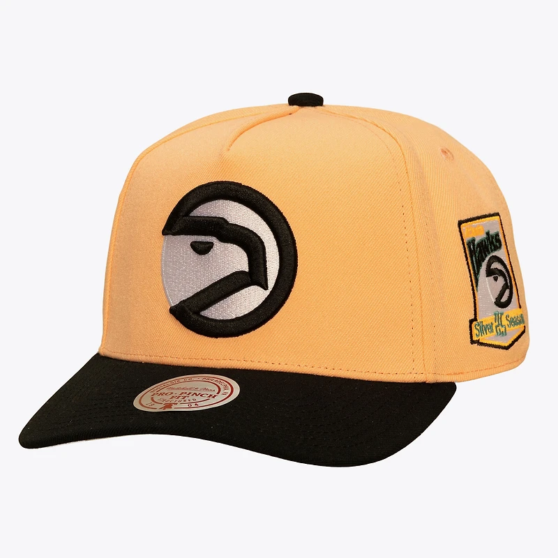 Men's Mitchell & Ness Peach/Black Atlanta Hawks In the City Pro Pinch Snapback Hat