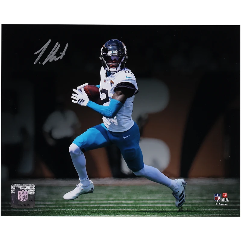 Travis Hunter Jacksonville Jaguars Autographed 8" x 10" White Jersey Running Spotlight Photograph