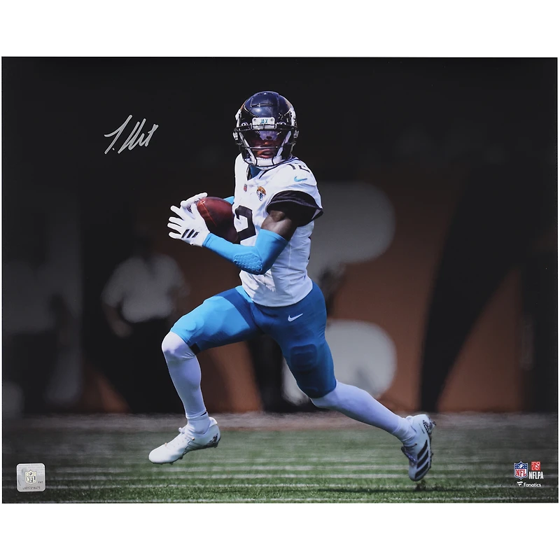 Travis Hunter Jacksonville Jaguars Autographed 16" x 20" White Jersey Running Spotlight Photograph