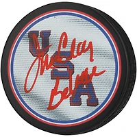 Jim Craig Team USA Autographed Hockey Puck with "Believe" Inscription