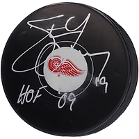 Steve Yzerman Detroit Red Wings Autographed Hockey Puck with "HOF 09" Inscription