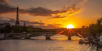 Assaf Frank - View of the Eiffel Tower with a bridge foreground during sunset, Paris