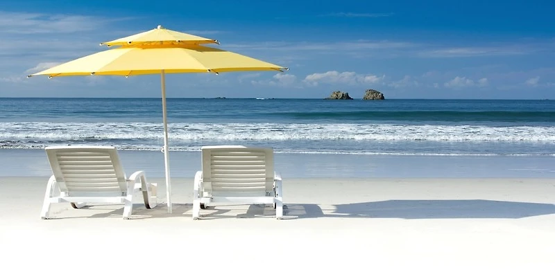 Magi Lorde - Yellow Umbrella, White chairs on Beach