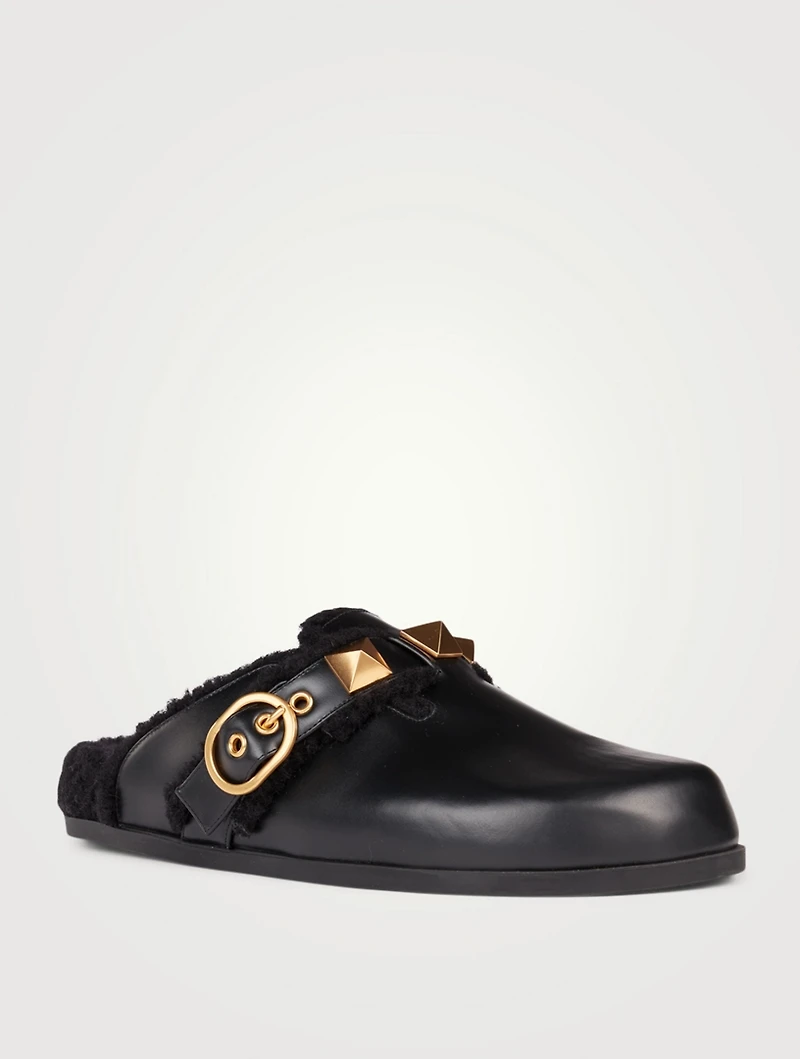Roman Stud Leather And Shearling Flat Mules