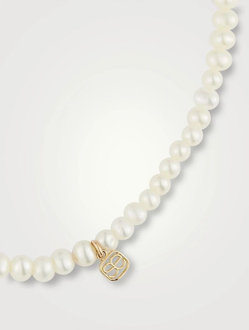 Pearl Bracelet With Large 14K Gold Diamond Evil Eye Charm