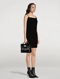 B-Buzz 23 Vinyl And Leather Top Handle Bag
