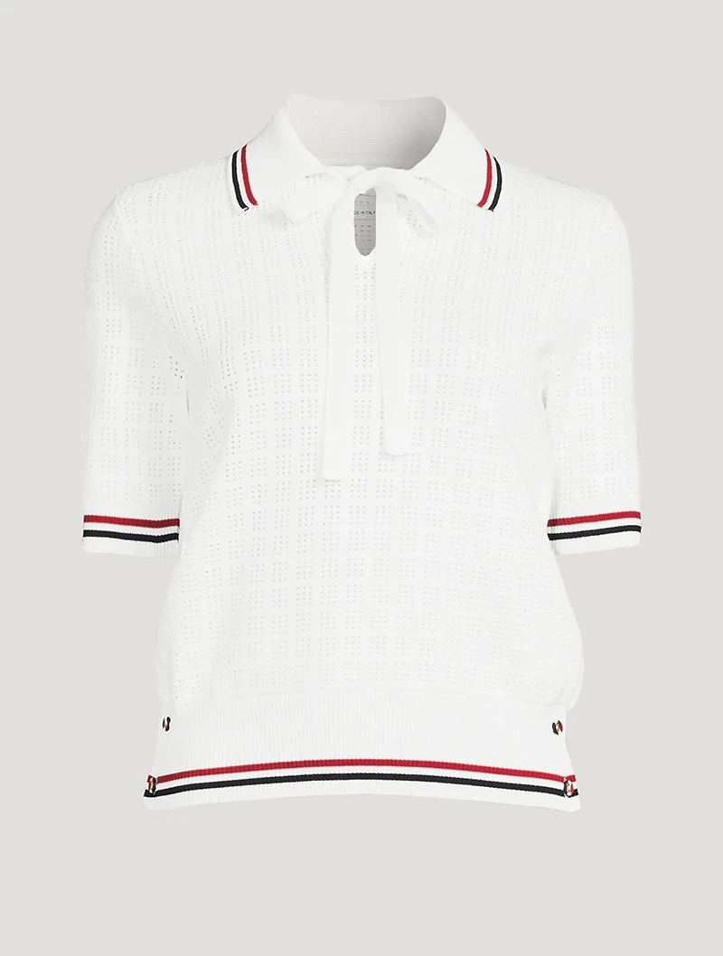 Pull à col cravate en tissu ajouré