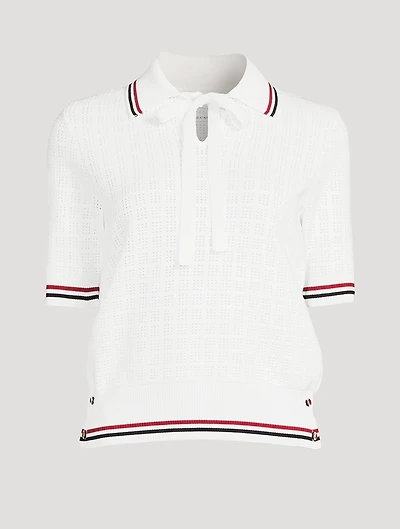 Pull à col cravate en tissu ajouré