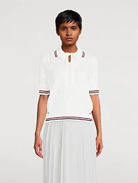 Pull à col cravate en tissu ajouré