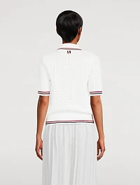 Pull à col cravate en tissu ajouré