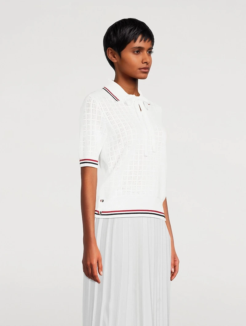 Pull à col cravate en tissu ajouré