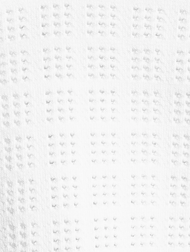 Pull à col cravate en tissu ajouré