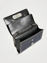 The Slash Four-Ring Denim Clutch