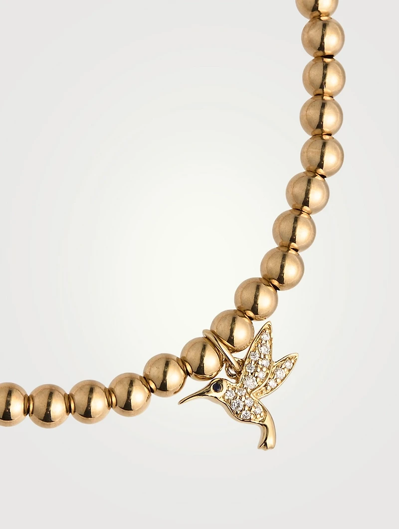 14K Gold Beaded Bracelet With Small 14K Diamond Hummingbird Charm