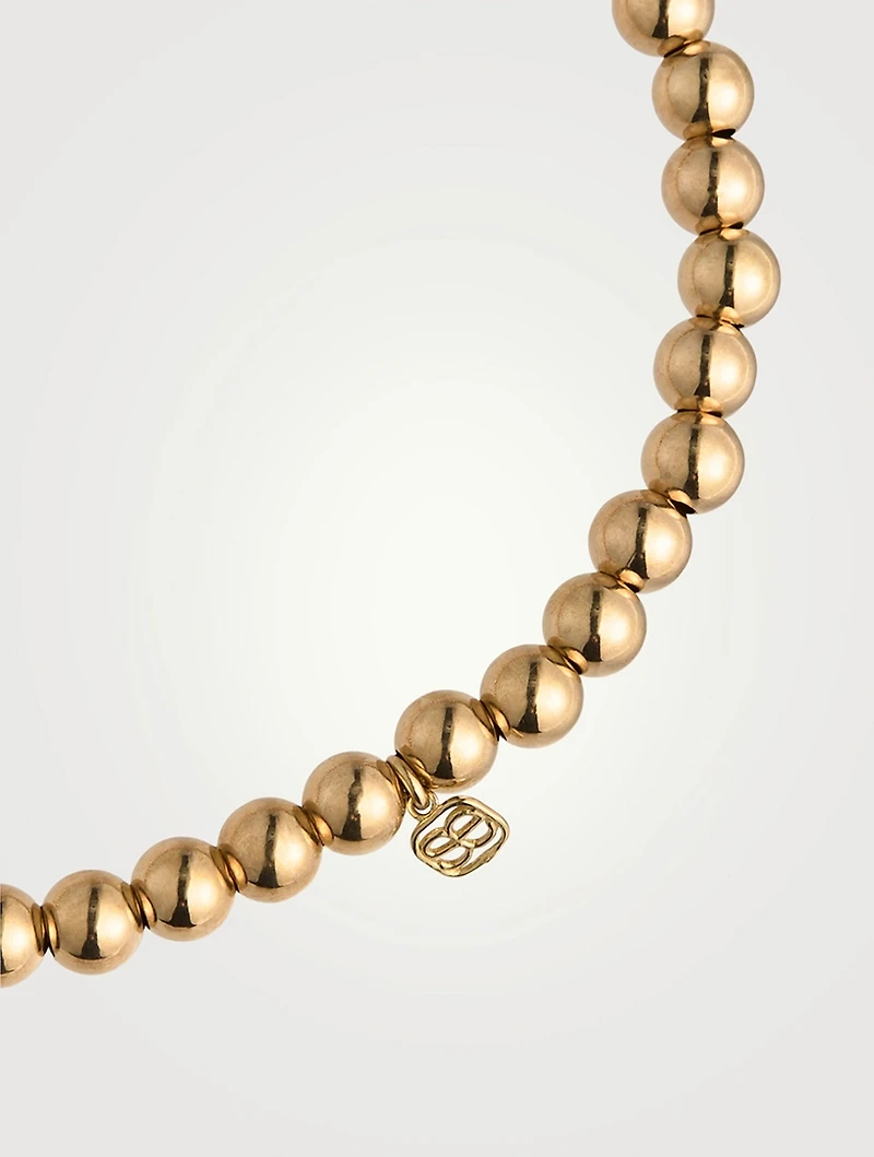 14K Gold Beaded Bracelet With Small 14K Diamond Hummingbird Charm