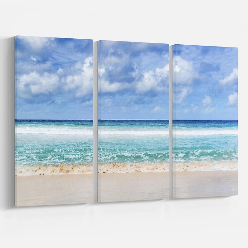 Designart Tranquil Beach under White Clouds Canvas Wall Art