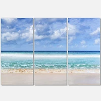 Designart Tranquil Beach under White Clouds Canvas Wall Art