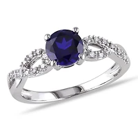 Tangelo 1 Carat T.G.W. Created Blue Sapphire and 0.10 Carat T.W. Diamond 10 K White Gold Cross-Over Ring