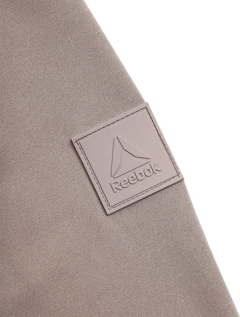 Veste pour femmes Reebok en maille extensible et tissu matelassé isolant