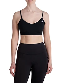 Reebok Everyday Racerback Soutien-gorge de sport pour femme avec empiècement en maille et bonnets amovibles