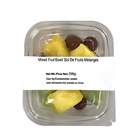 Mixed bowl of pineapple, melons and grapes