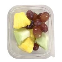 Mixed bowl of pineapple, melons and grapes